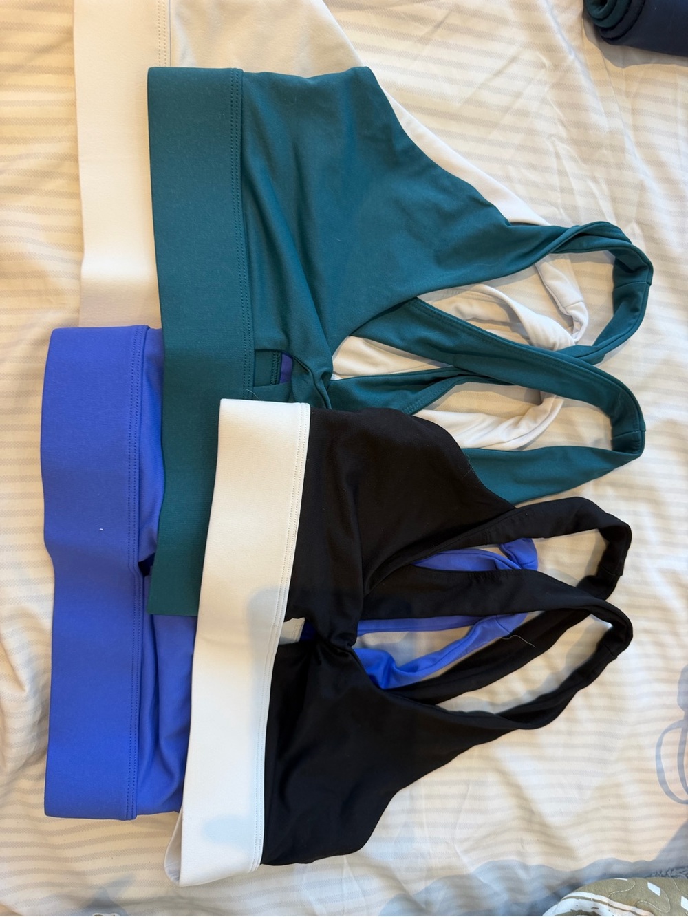 Oasis Front twist Sports Bra - Teal, Black & Blue- Set of 4- Fabletics